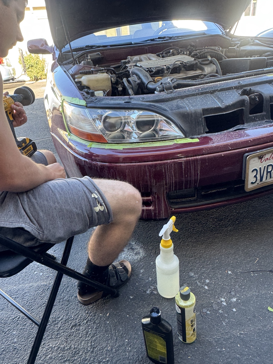 Restoration process on a maroon car