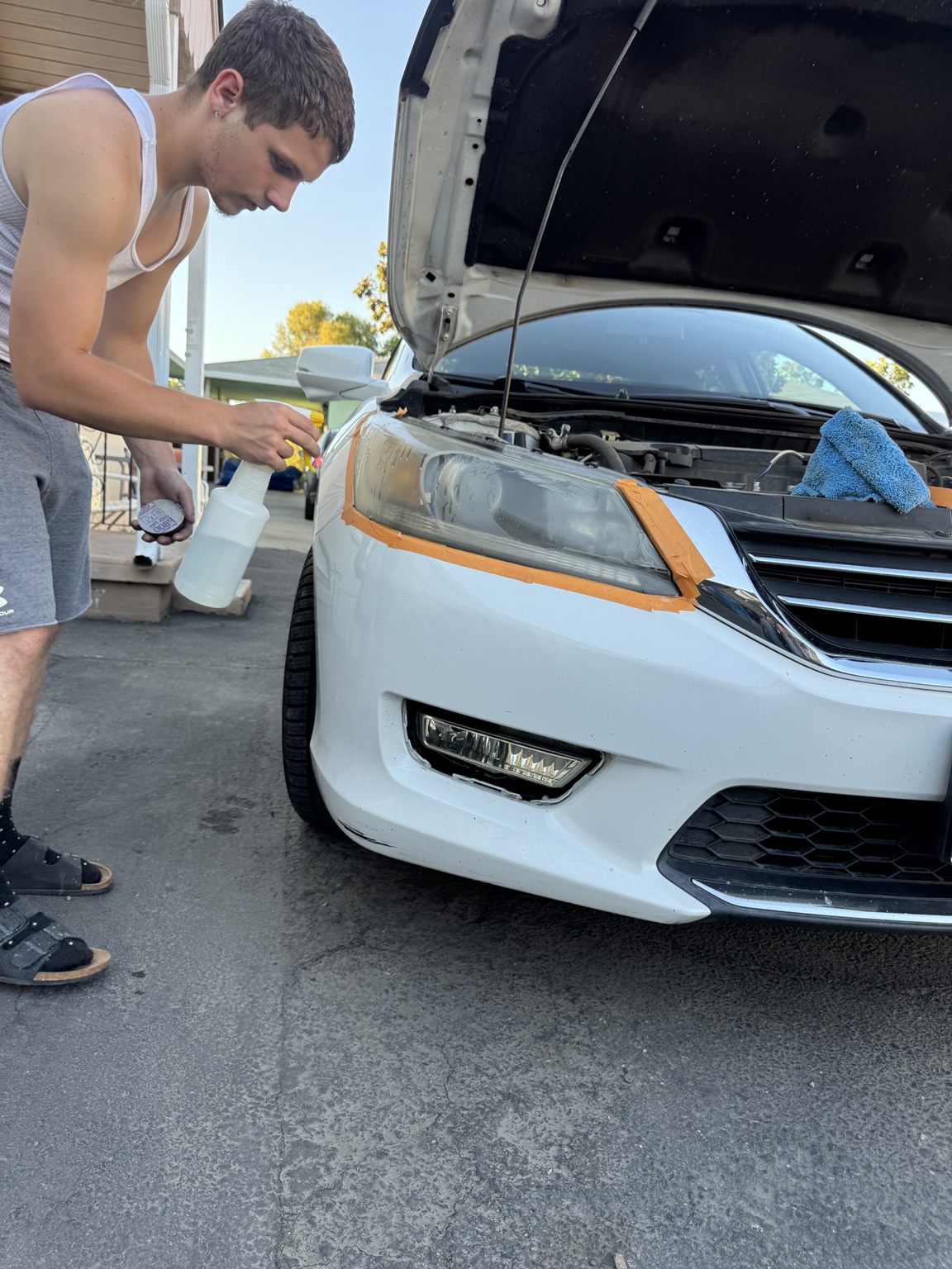 Working on a white car during the restoration process